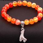 Pulseras perlas naranja con patin outlet patin patinaje artistico