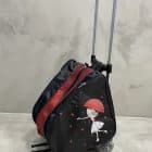 mochila carro negra muñeca paraguas